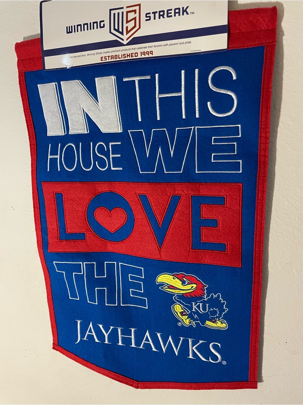 KU Jayhawks "In This House We Love The Jayhawks" Wall Banner - Blue & Red